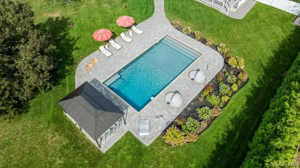 a balcony with table and chairs