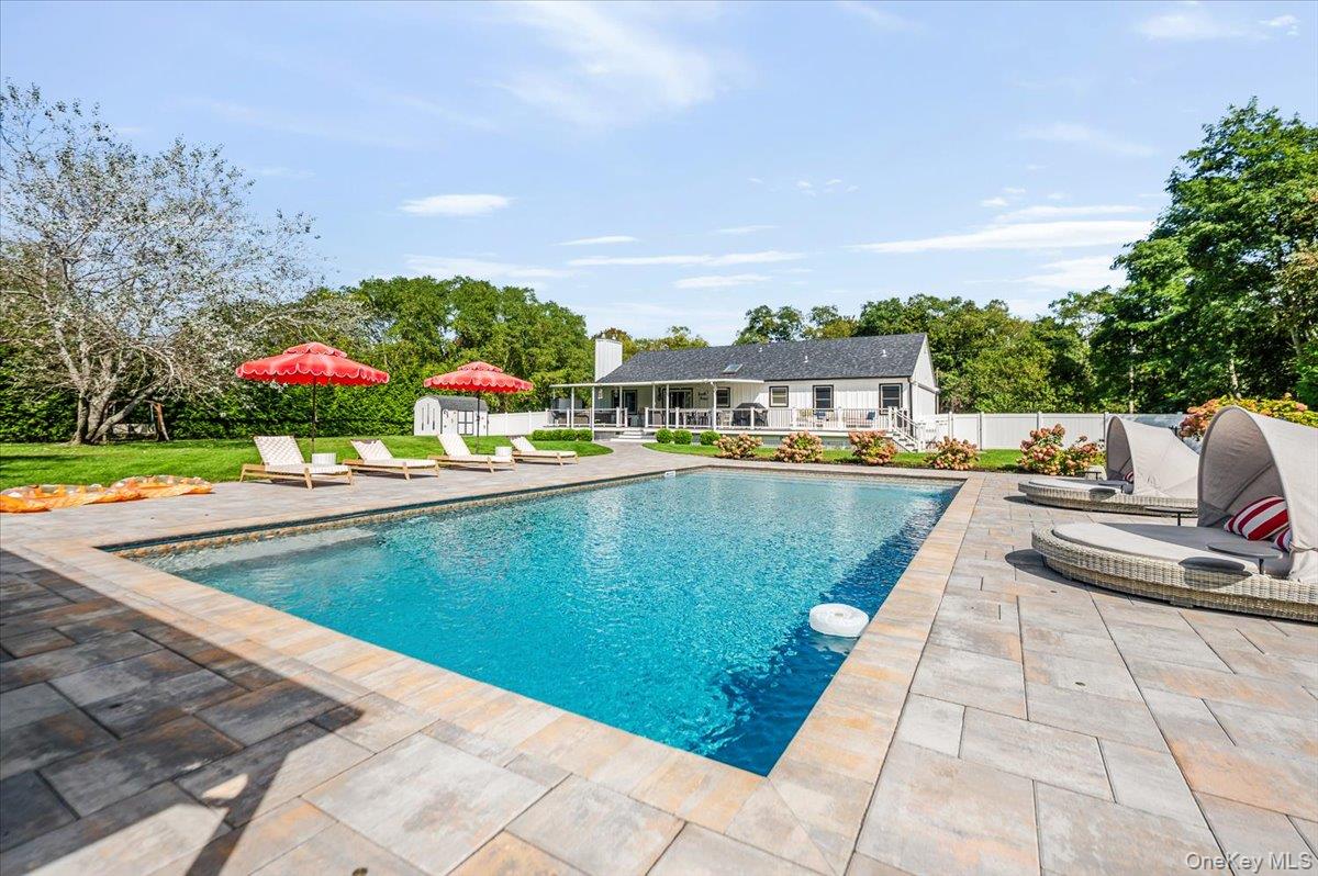 525 Rocky Point Road East Marion, NY 11939 - Photo 6 of 48 a view of a swimming pool with a lounge chairs