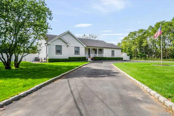 a front view of a house with yard