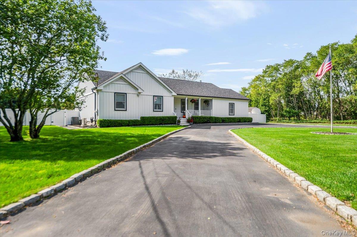 525 Rocky Point Road East Marion, NY 11939 - Photo 7 of 48 a front view of a house with yard