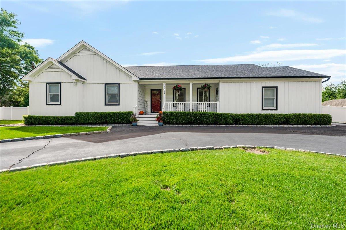 525 Rocky Point Road East Marion, NY 11939 - Photo 8 of 48 a front view of house with yard and green space