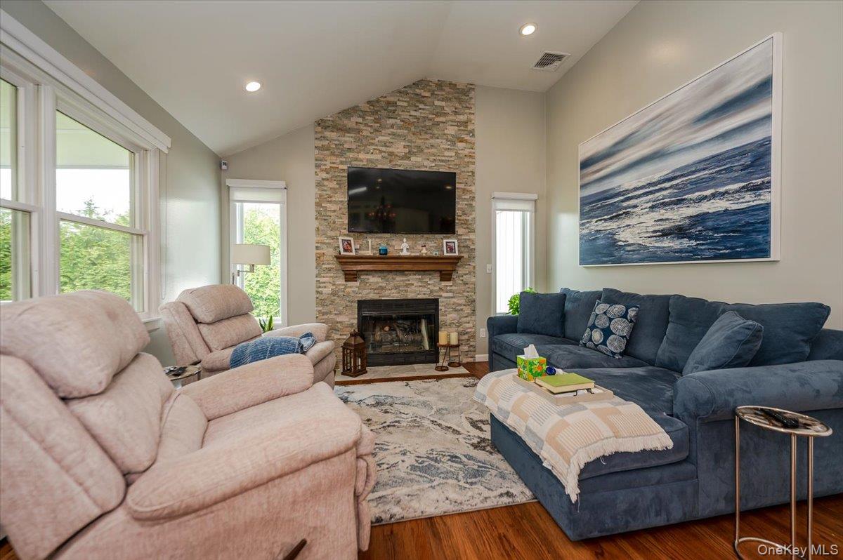525 Rocky Point Road East Marion, NY 11939 - Photo 10 of 48 a living room with furniture and a fireplace
