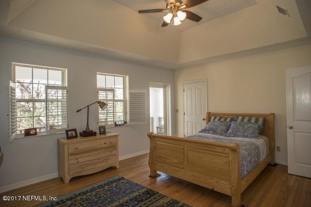 275 Jellison Road St. Augustine, FL 32080 - Photo 14 of 37 a bedroom with a large bed and windows