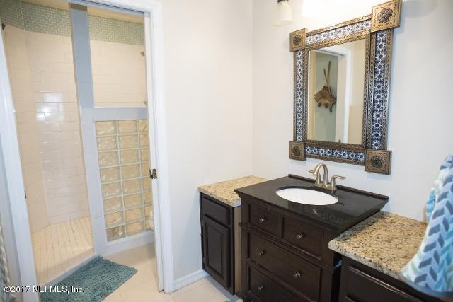 275 Jellison Road St. Augustine, FL 32080 - Photo 18 of 37 a bathroom with a granite countertop sink and a mirror
