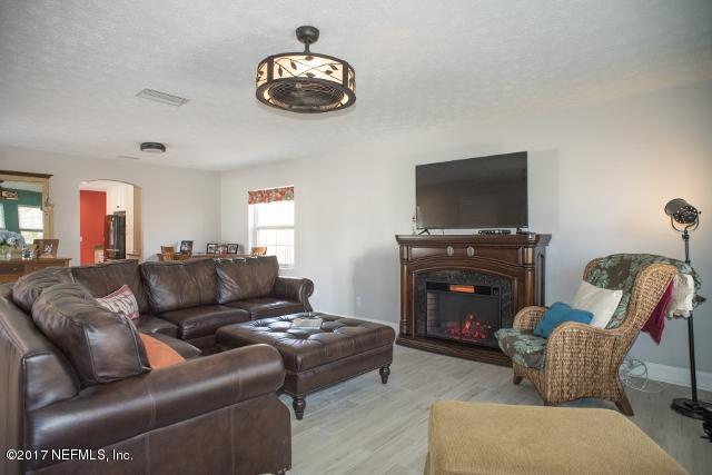 275 Jellison Road St. Augustine, FL 32080 - Photo 6 of 37 a living room with furniture and a flat screen tv