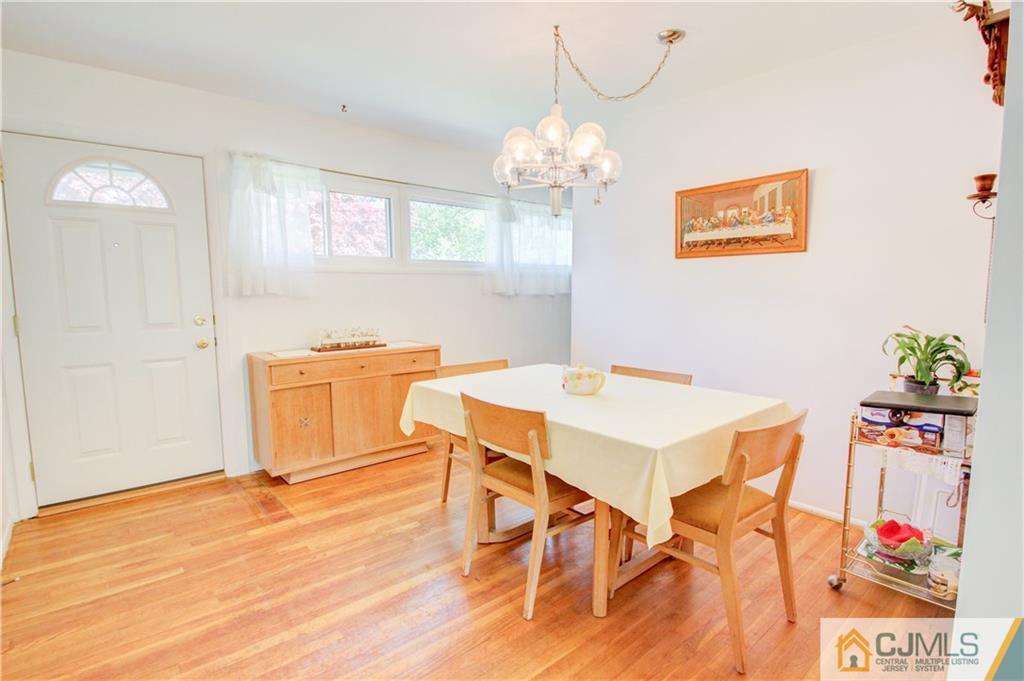 5 Purdue Road Old Bridge, NJ 08859 - Photo 2 of 25 a view of a dining room with furniture wooden floor and chandelier