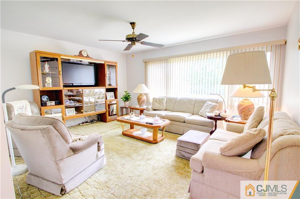 5 Purdue Road Old Bridge, NJ 08859 - Photo 4 of 25 a living room with furniture and a flat screen tv