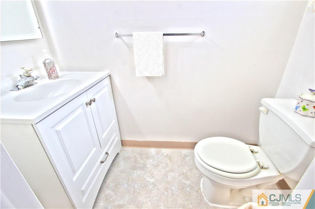 5 Purdue Road Old Bridge, NJ 08859 - Photo 8 of 25 a white toilet sitting next to a bathroom sink