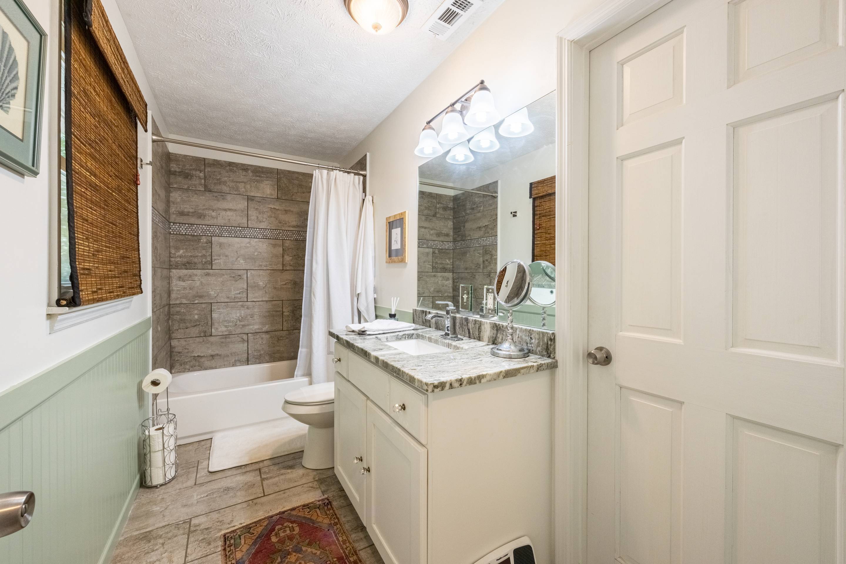 396 Cardinal Lane Toccoa, GA 30577 - Photo 19 of 103 a bathroom with a granite countertop sink toilet and shower