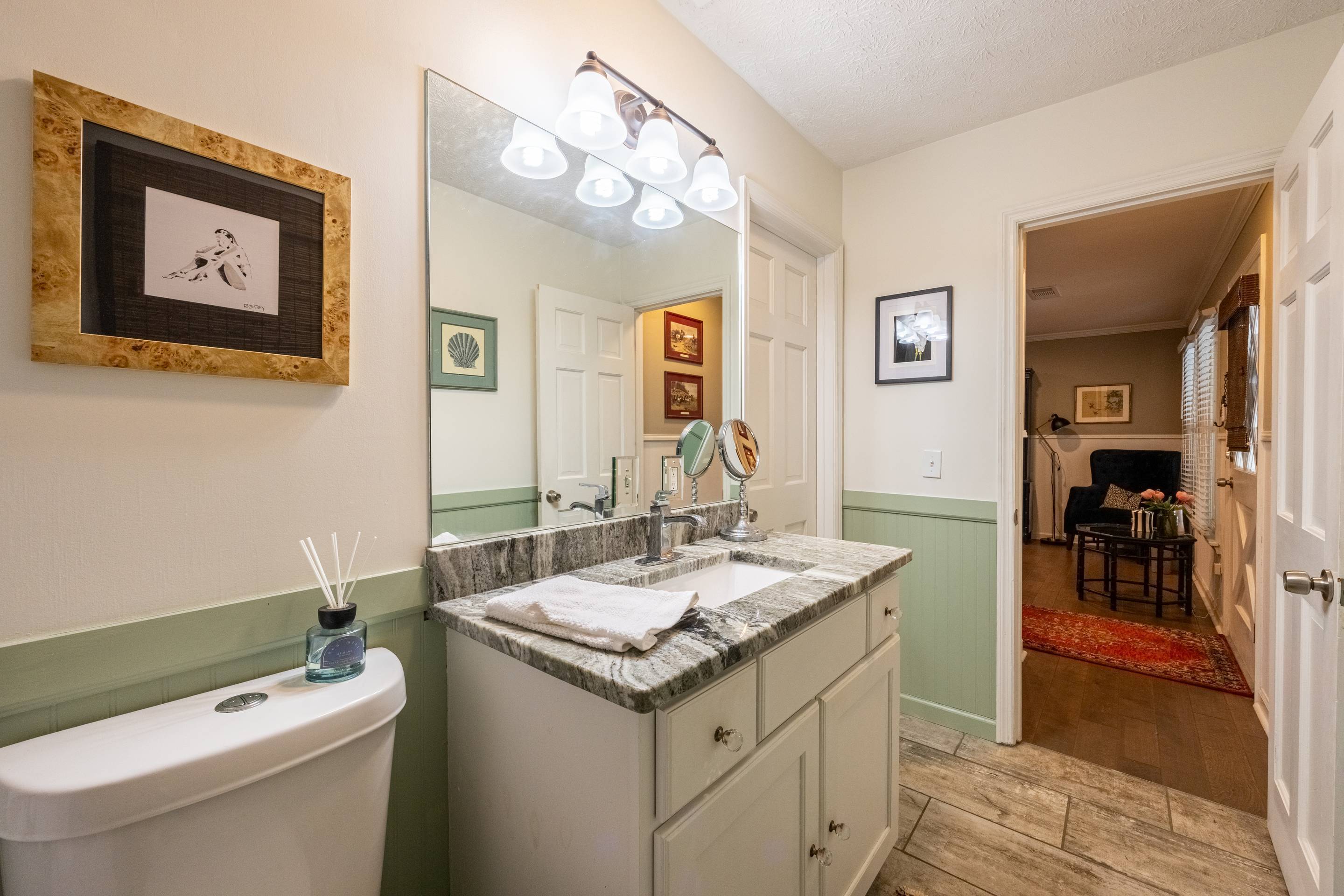396 Cardinal Lane Toccoa, GA 30577 - Photo 20 of 103 a bathroom with a granite countertop sink a toilet and a mirror