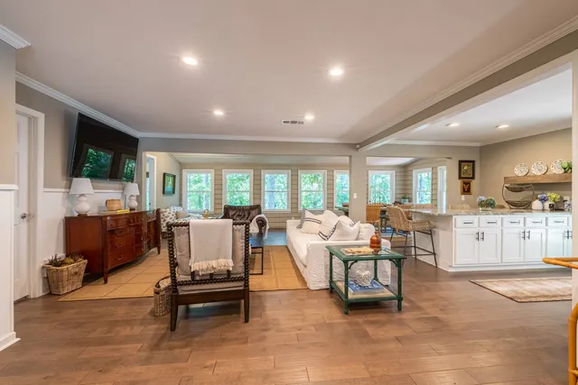 a spacious bedroom with a bed and a large window