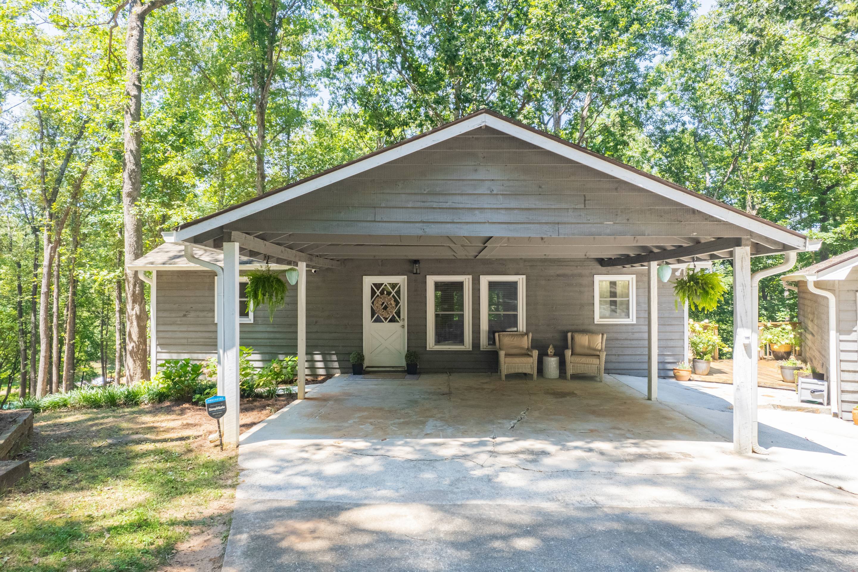 396 Cardinal Lane Toccoa, GA 30577 - Photo 3 of 103 a front view of a house with a yard and outdoor seating
