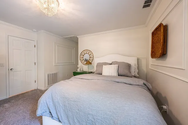 a bathroom with a granite countertop sink a mirror and shower