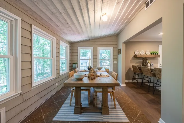 a bedroom with a bed and a desk