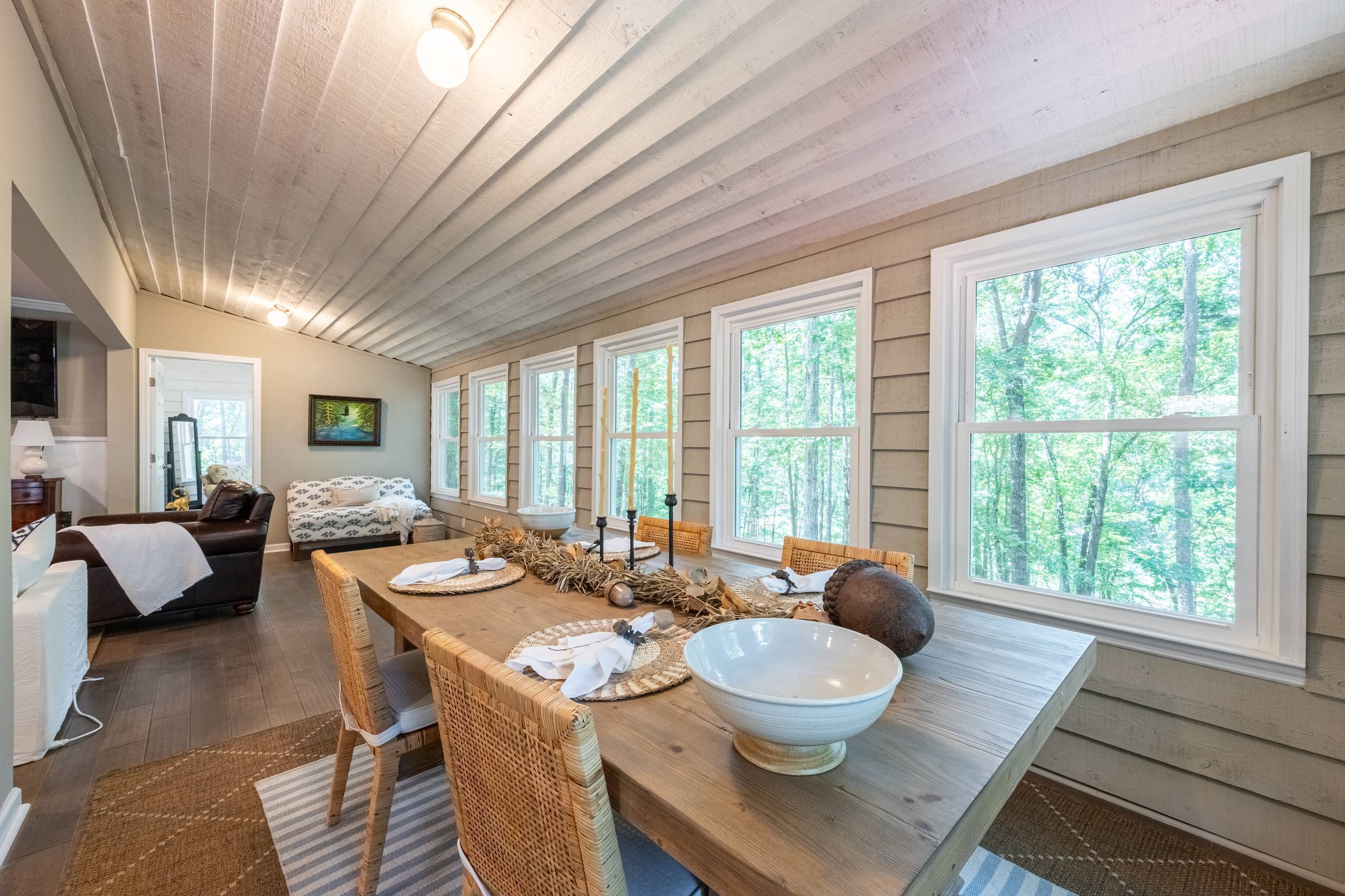 396 Cardinal Lane Toccoa, GA 30577 - Photo 39 of 103 a dining room with furniture a large window and a rug