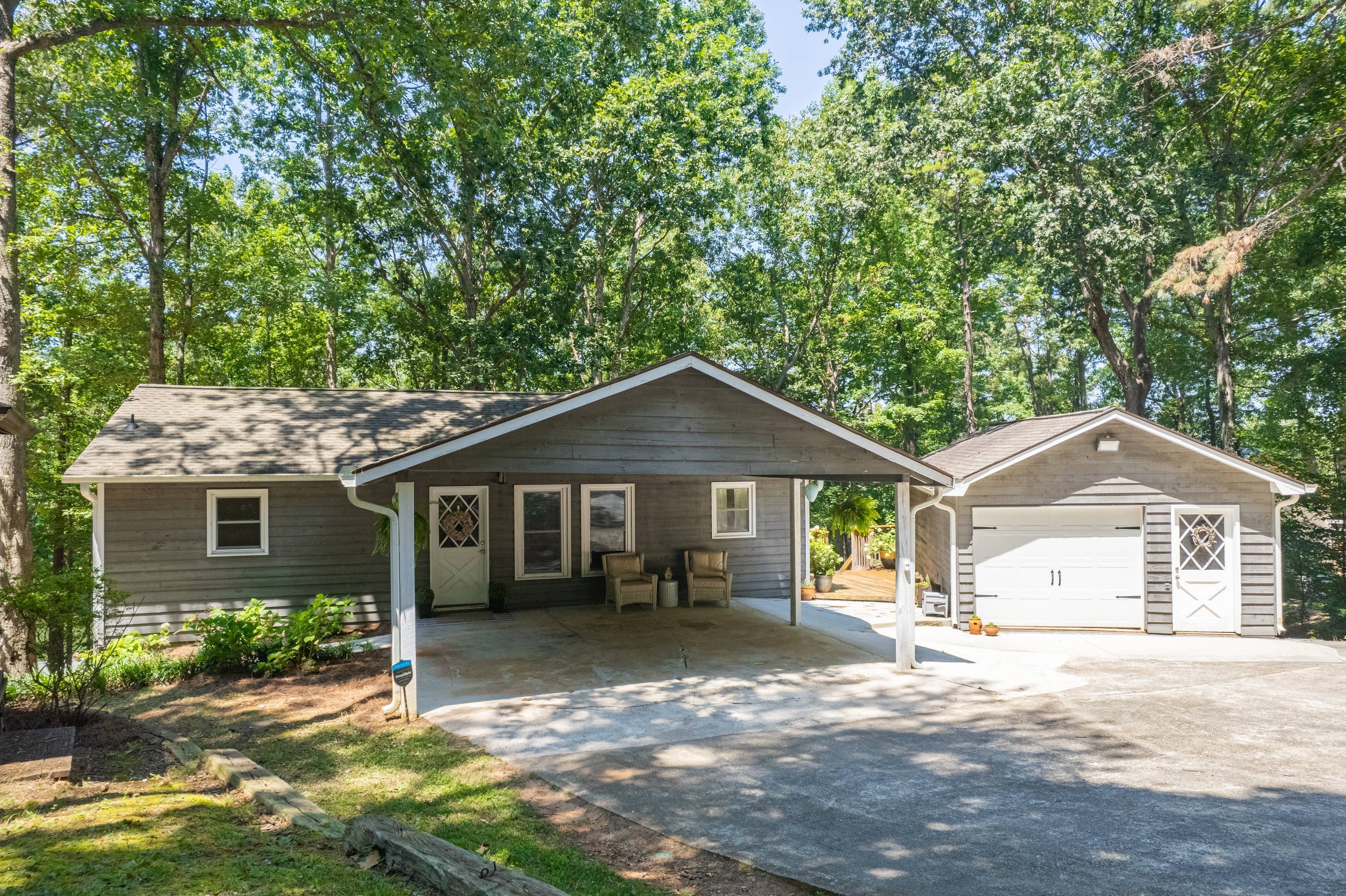396 Cardinal Lane Toccoa, GA 30577 - Photo 4 of 103 a front view of a house with a yard and potted plants