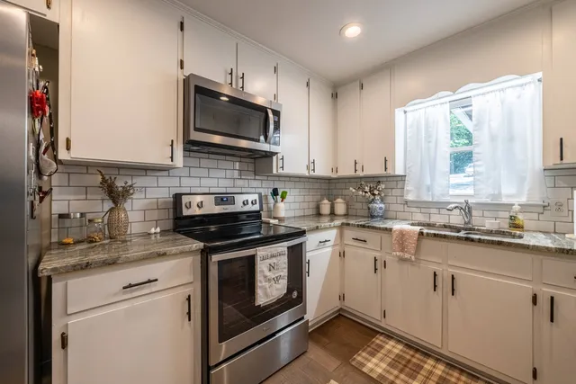 a view of a lake with boats and trees in the background