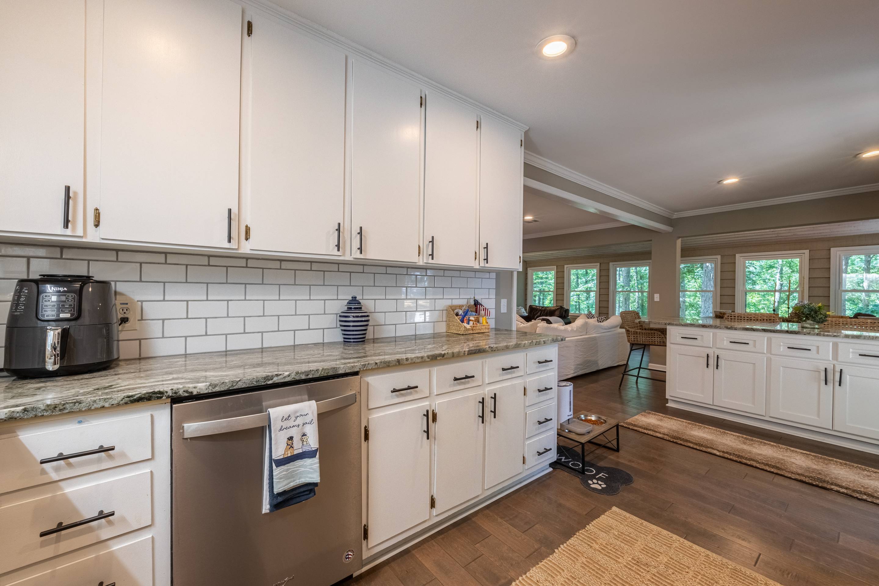 396 Cardinal Lane Toccoa, GA 30577 - Photo 47 of 103 a kitchen with granite countertop a sink stove and cabinets