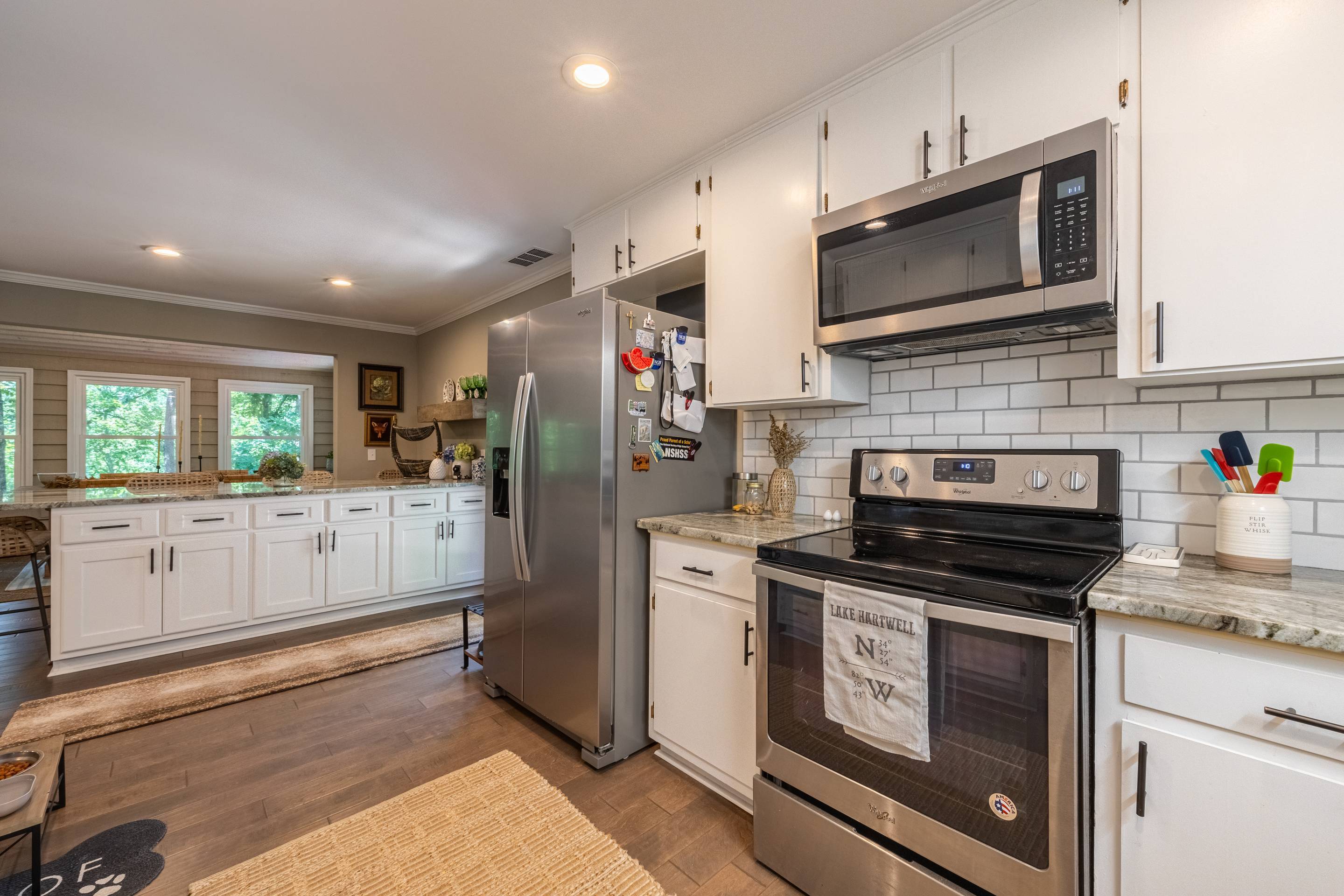 396 Cardinal Lane Toccoa, GA 30577 - Photo 48 of 103 a kitchen with stainless steel appliances granite countertop a stove a microwave and a refrigerator