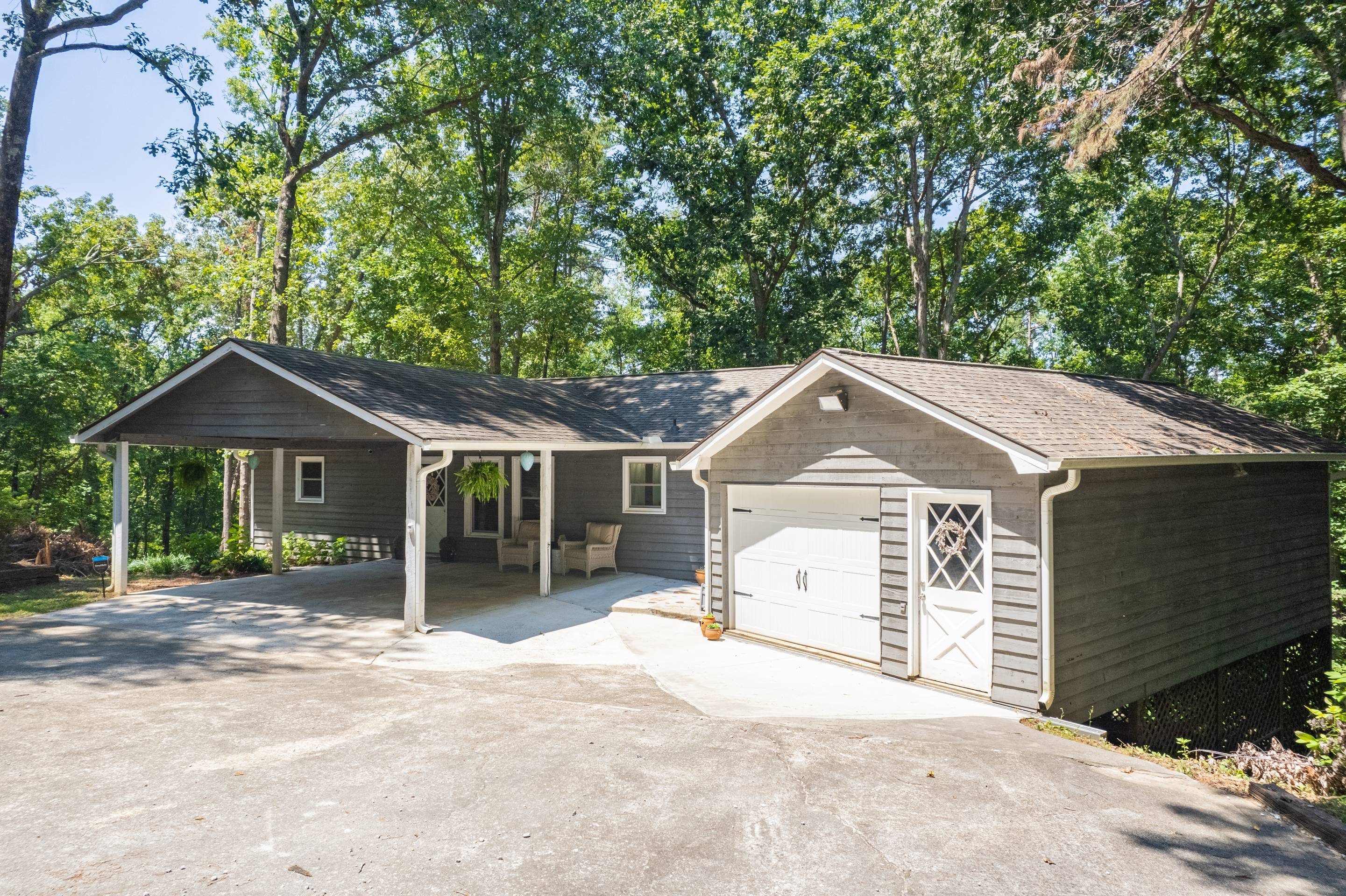 396 Cardinal Lane Toccoa, GA 30577 - Photo 6 of 103 a front view of a house with a yard and garage