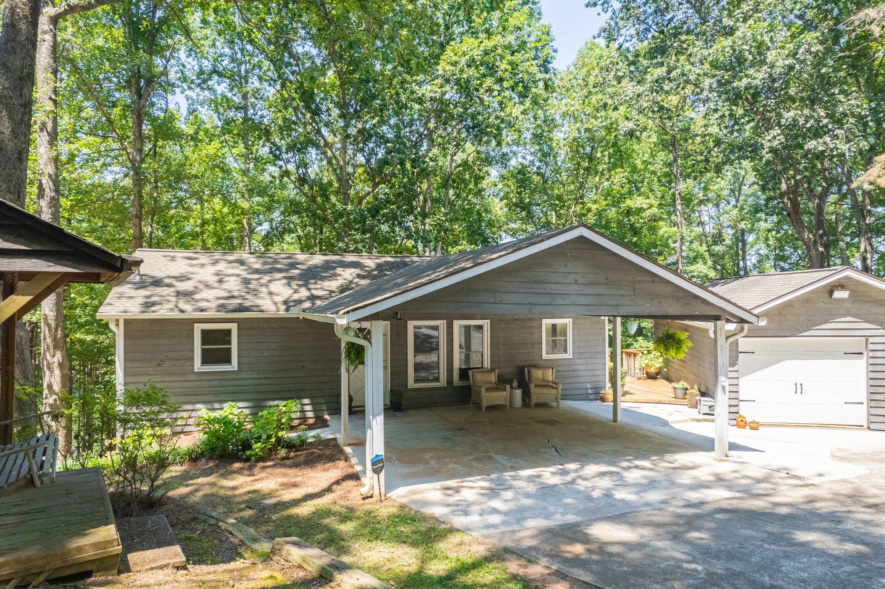 396 Cardinal Lane Toccoa, GA 30577 - Photo 7 of 103 a front view of a house with a yard and potted plants