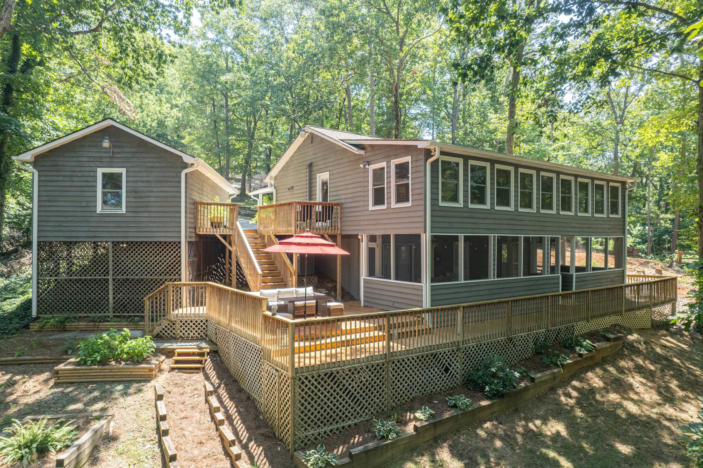 396 Cardinal Lane Toccoa, GA 30577 - Photo 75 of 103 a front view of a house with garden