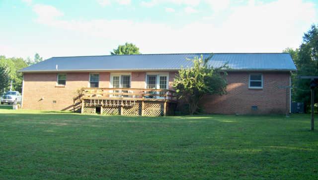 689 Ghea Road Normandy, TN 37360 - Photo 3 of 19 a front view of house with yard and glass windows