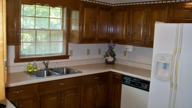 689 Ghea Road Normandy, TN 37360 - Photo 4 of 19 a kitchen with a refrigerator and a sink