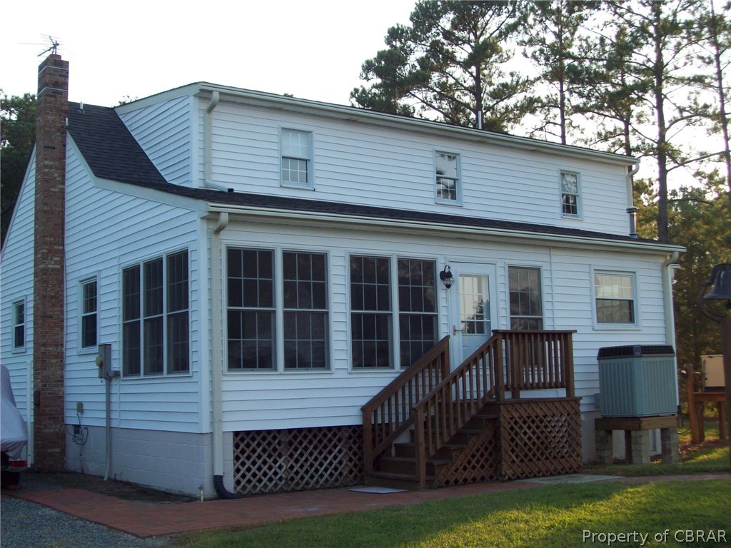 195 Hurst Neck Road Onemo, VA 23130 - Photo 2 of 30 a front view of a house with garden