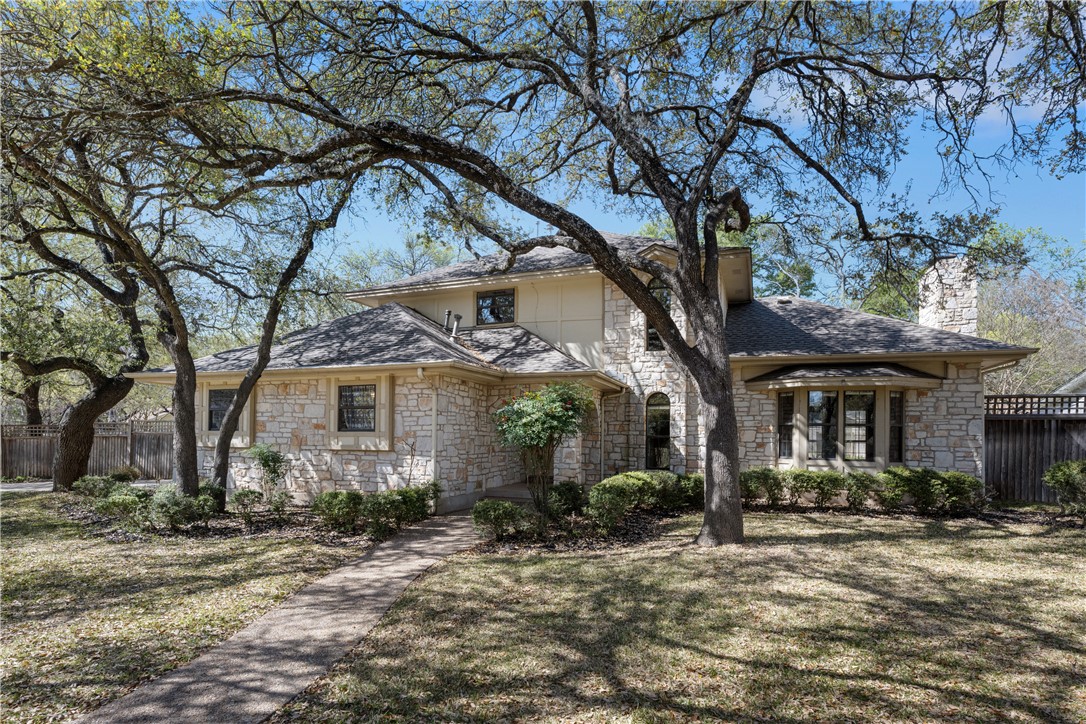 11748 D-K Ranch Road Austin, TX 78759 - Photo 1 of 1 a view of a house with a yard