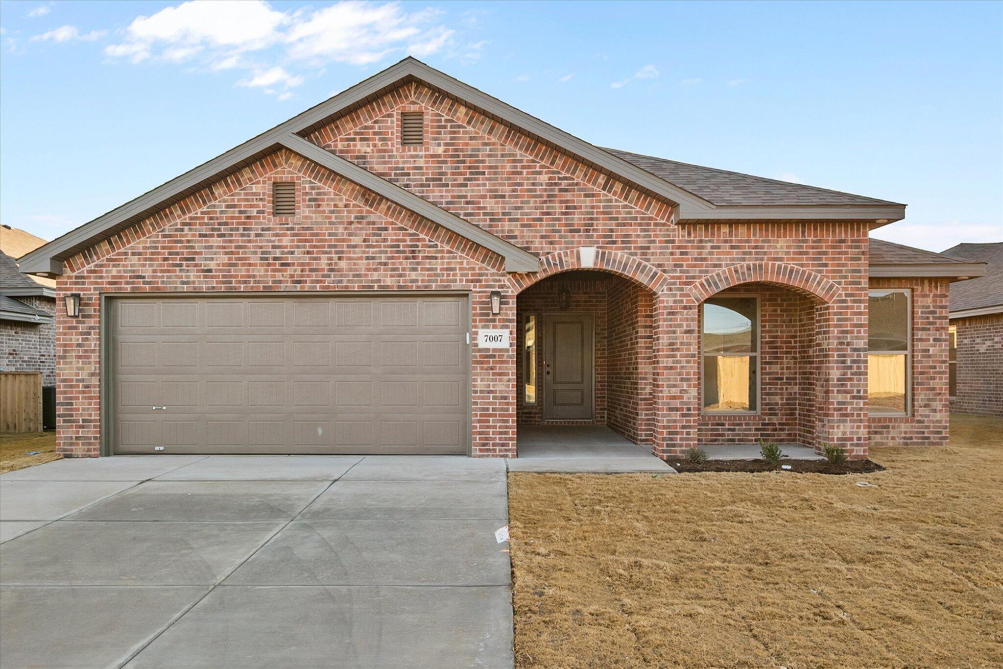 7007 56th Street Lubbock, TX 79407 - Photo 1 of 22 a front view of a house