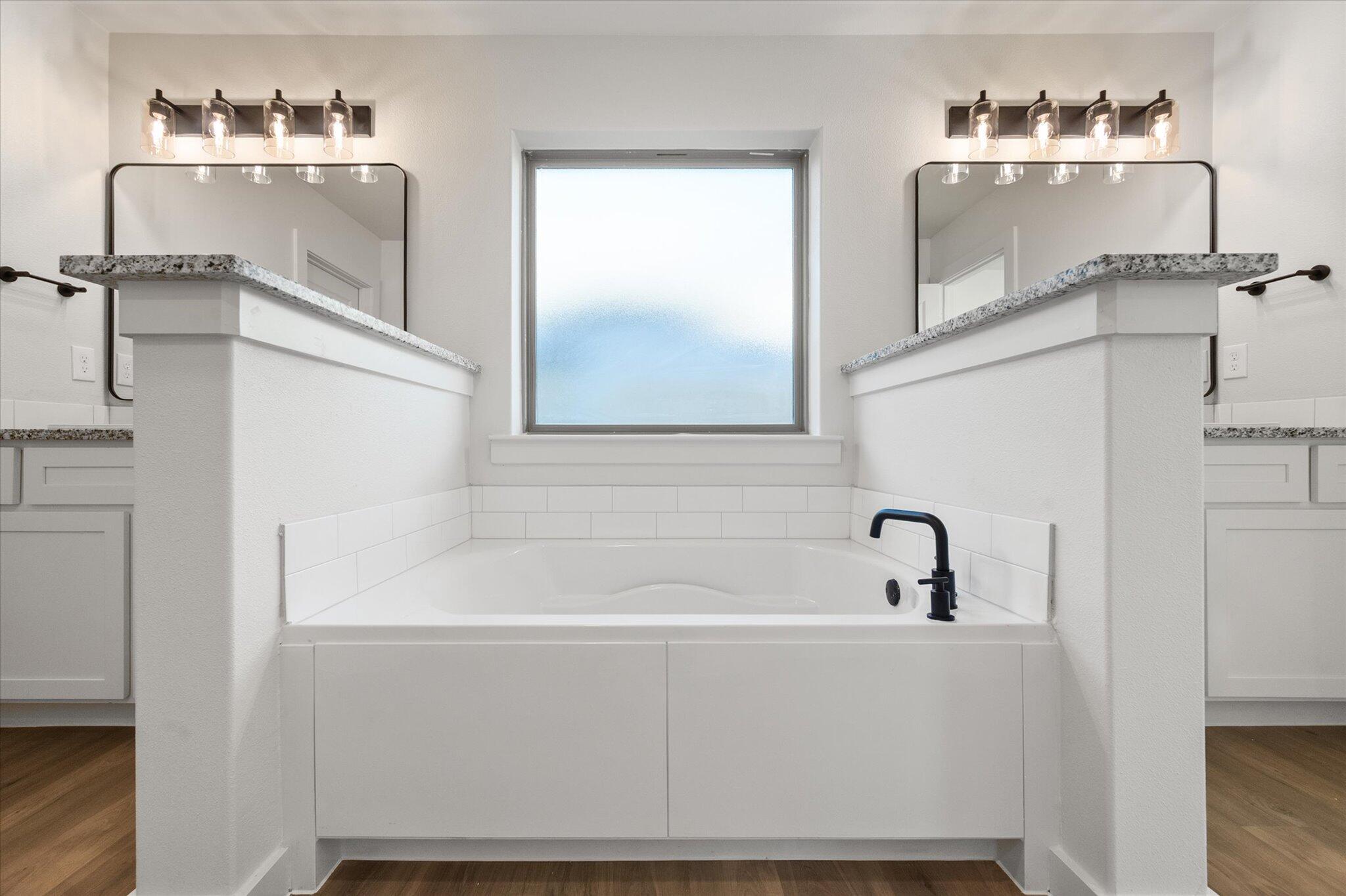 7007 56th Street Lubbock, TX 79407 - Photo 15 of 22 a bathroom with a bathtub