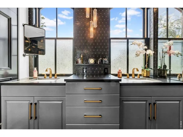 a bathroom with a sink and mirror