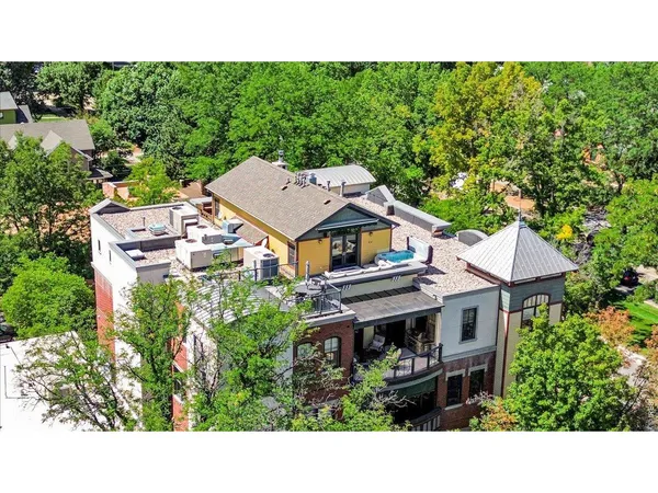 a aerial view of a house with garden space and street view