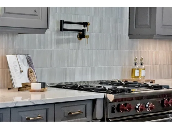 a kitchen with a stove and cabinets