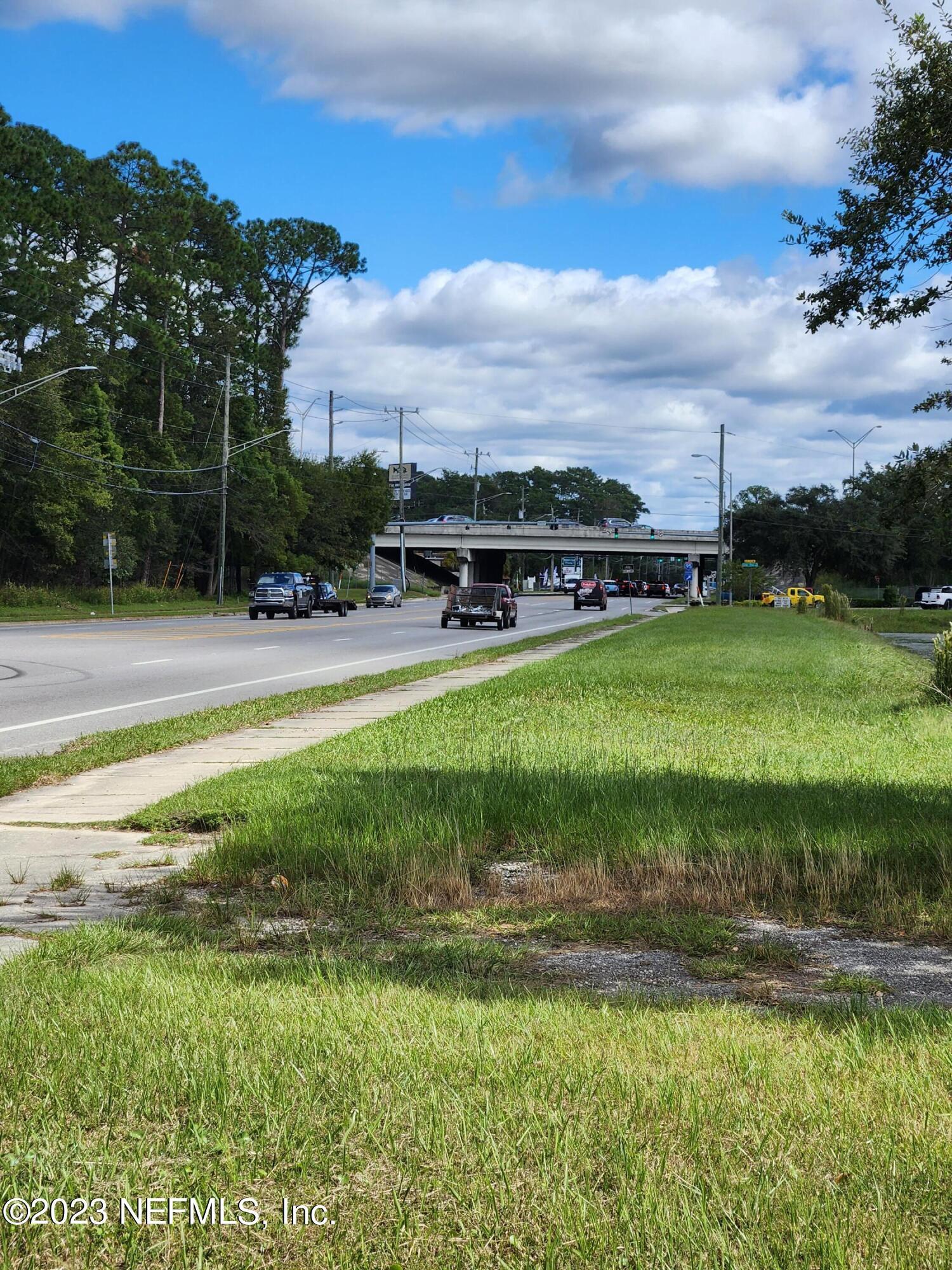 5314 Bowden Road Jacksonville, FL 32216 - Photo 12 of 17 a view of a swimming pool and a yard