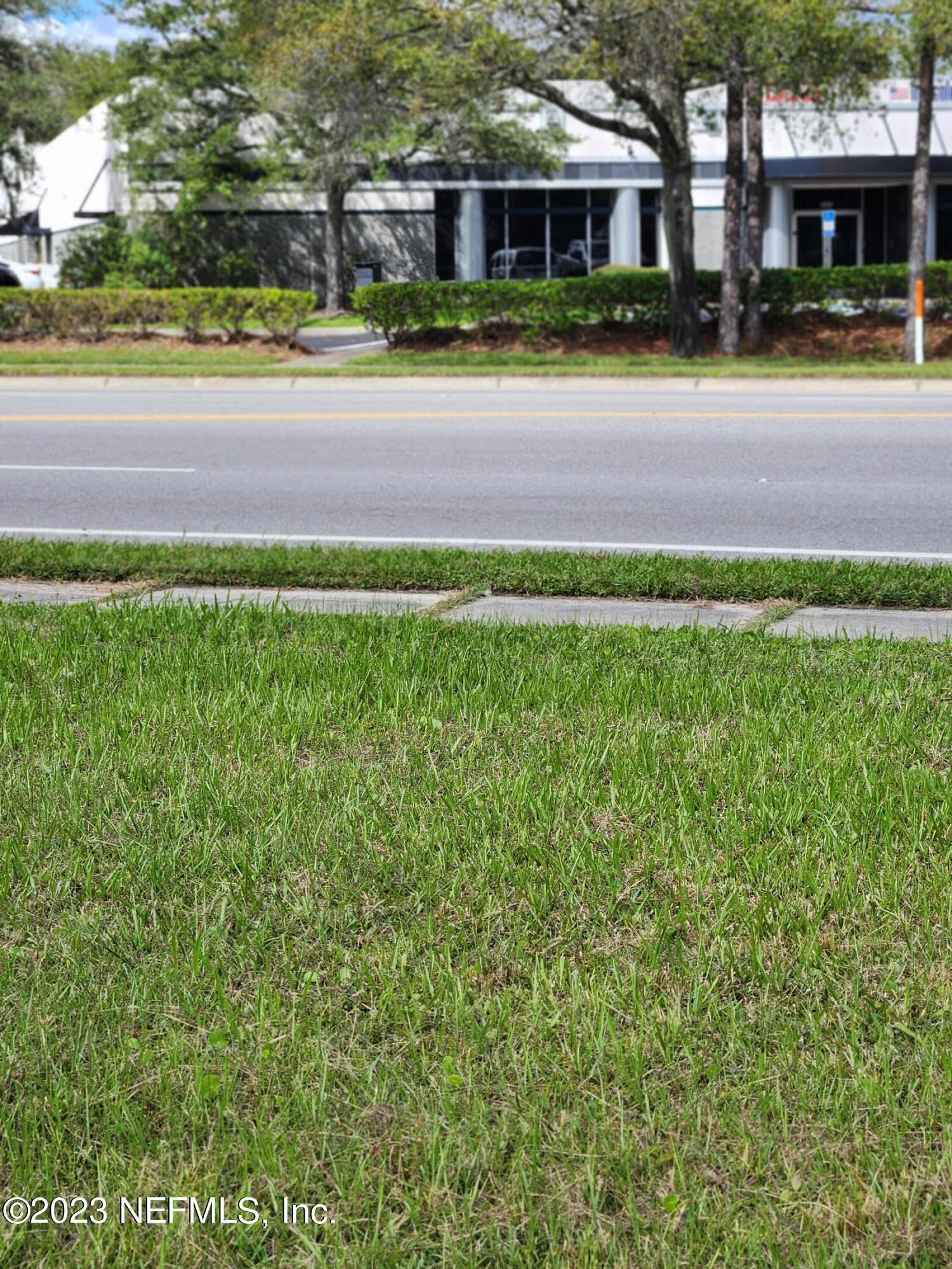5314 Bowden Road Jacksonville, FL 32216 - Photo 13 of 17 a front view of a house with a yard and trees