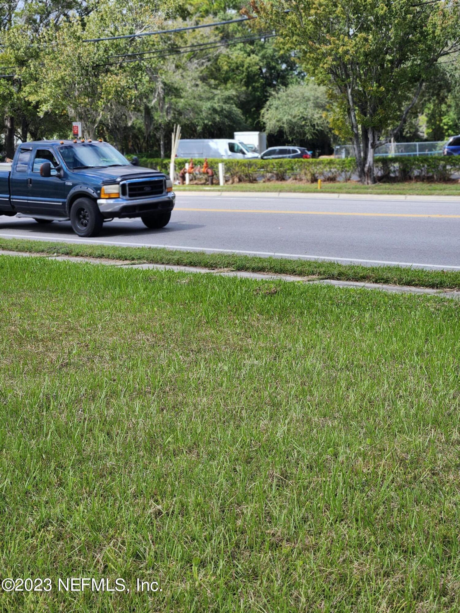 5314 Bowden Road Jacksonville, FL 32216 - Photo 14 of 17 a view of outdoor space with deck and yard