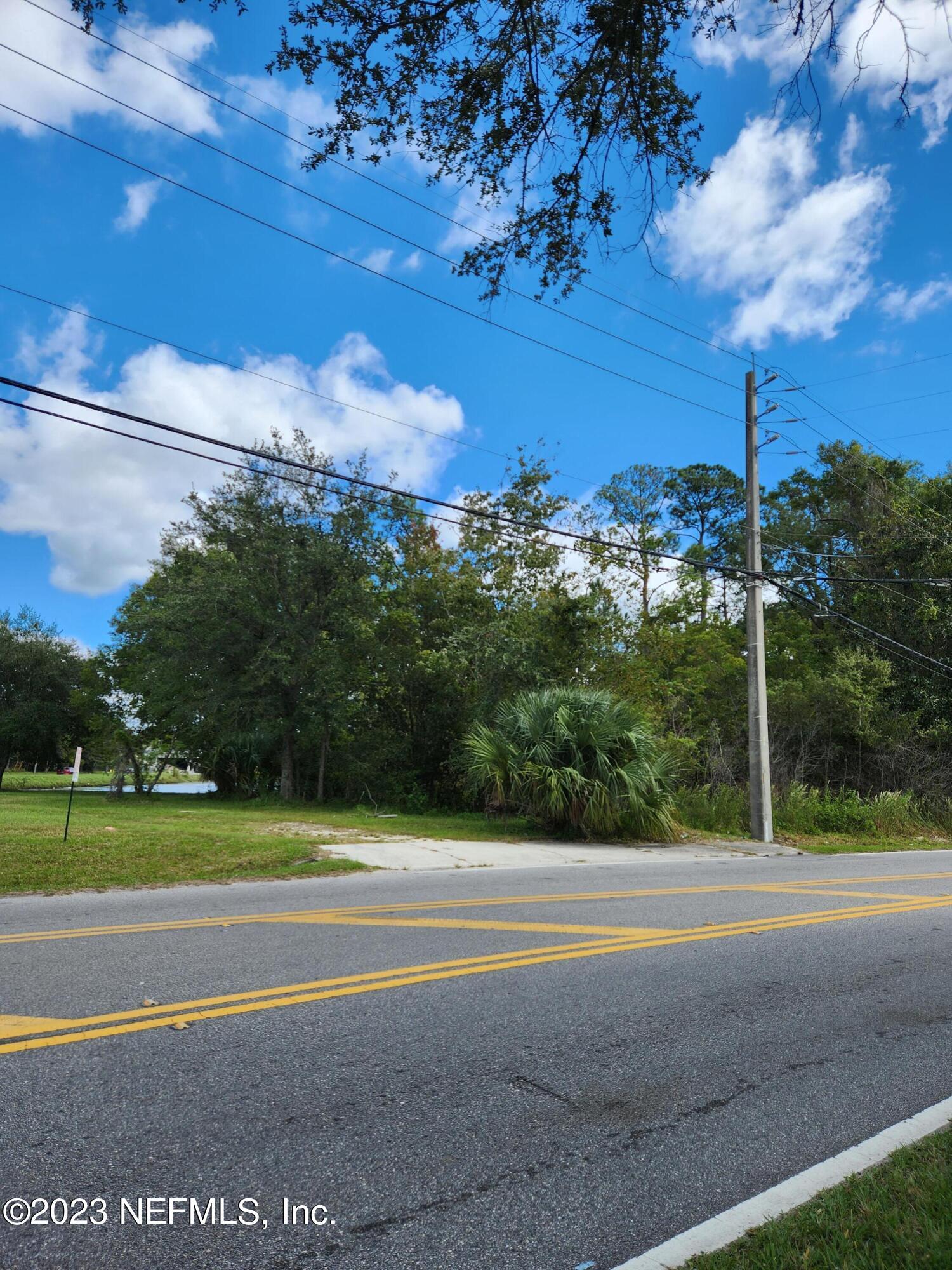 5314 Bowden Road Jacksonville, FL 32216 - Photo 2 of 17 a view of a yard and basketball court