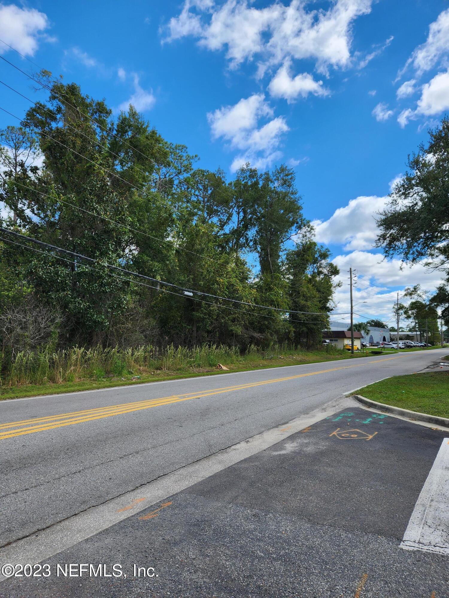 5314 Bowden Road Jacksonville, FL 32216 - Photo 5 of 17 a view of a field with a big house