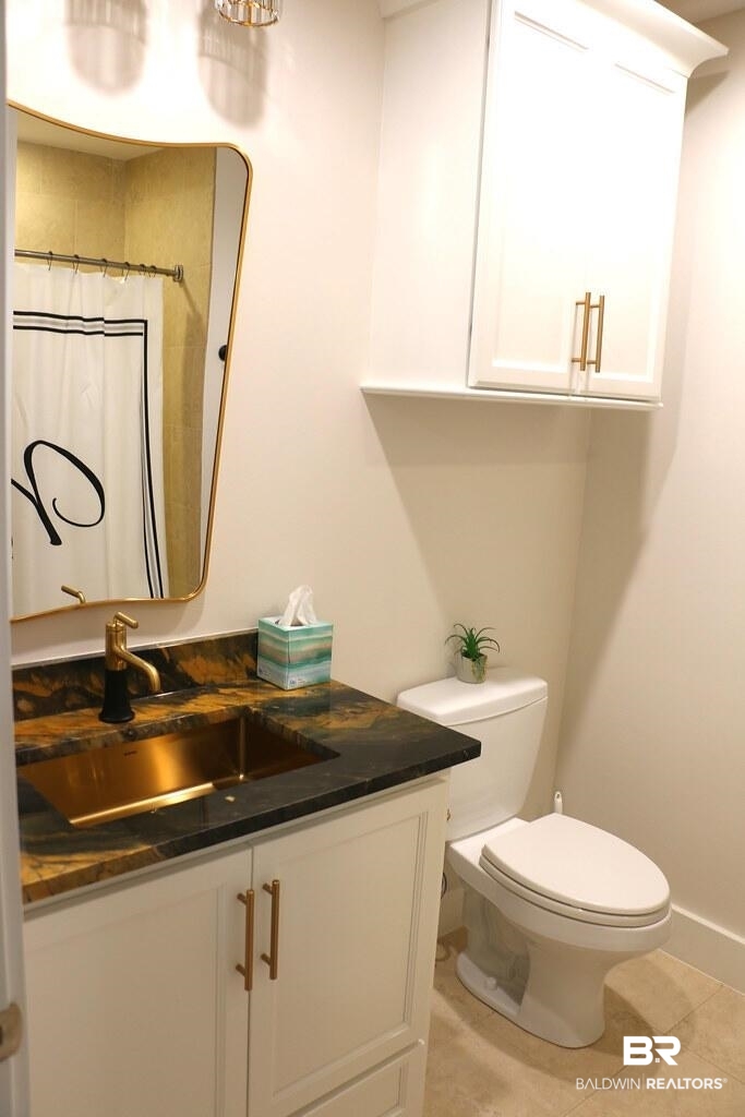18269 Colony Drive, Unit 803 Fairhope, AL 36532 - Photo 22 of 27 Full bathroom with a shower with shower curtain, vanity, and light tile patterned floors
