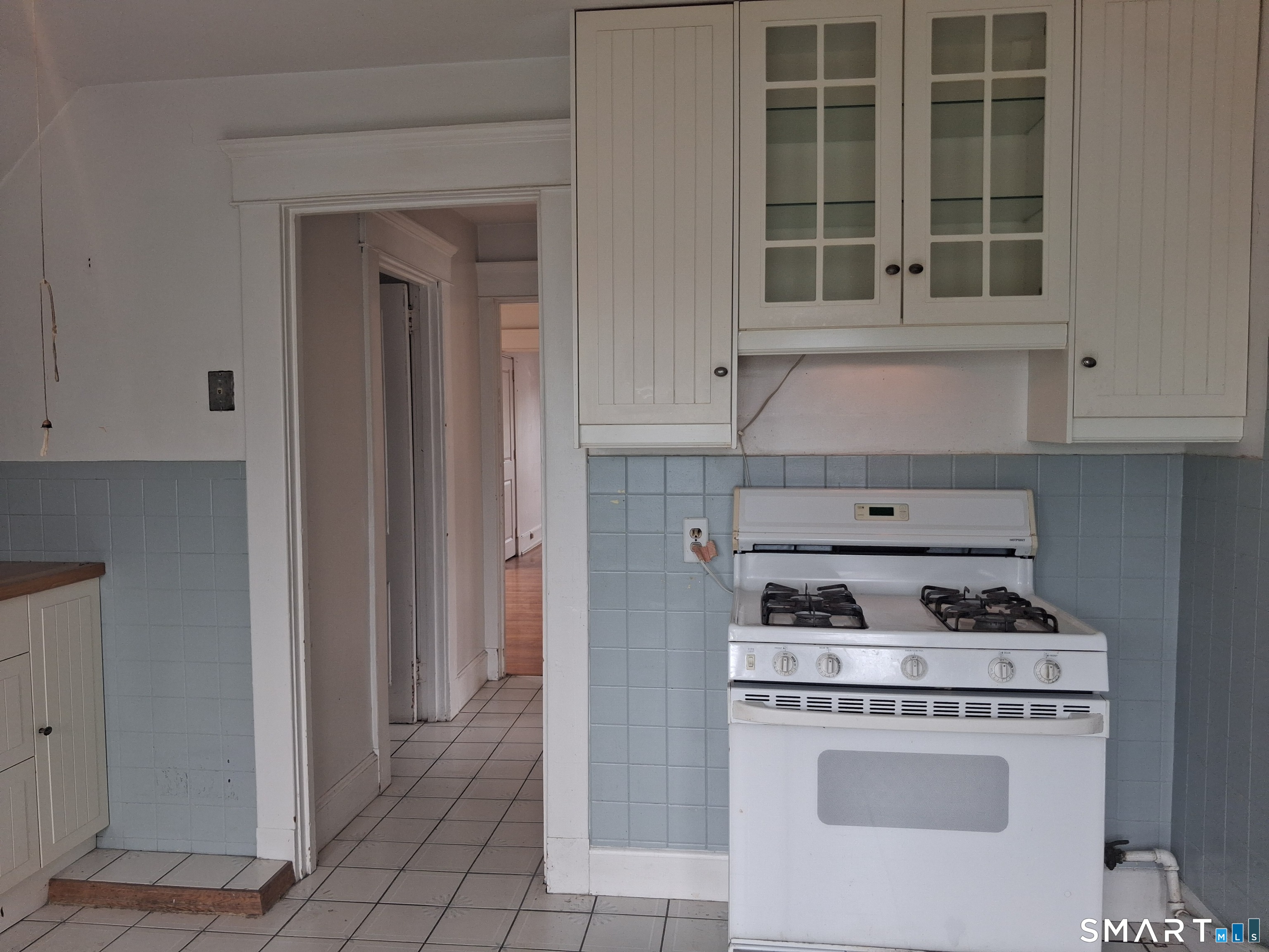 26 4th Street Hamden, CT 06514 - Photo 29 of 40 a kitchen with a stove and cabinets