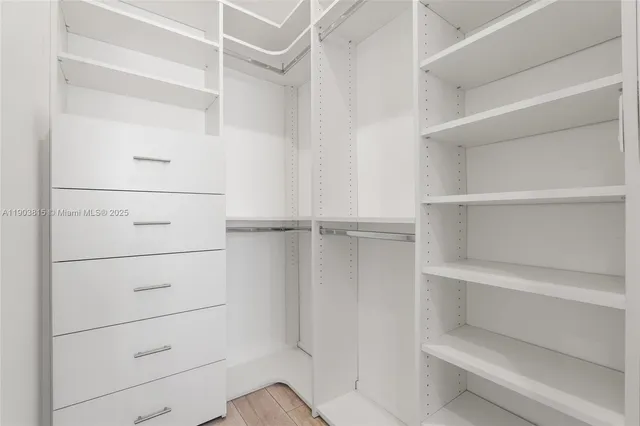 a view of an empty walk in closet