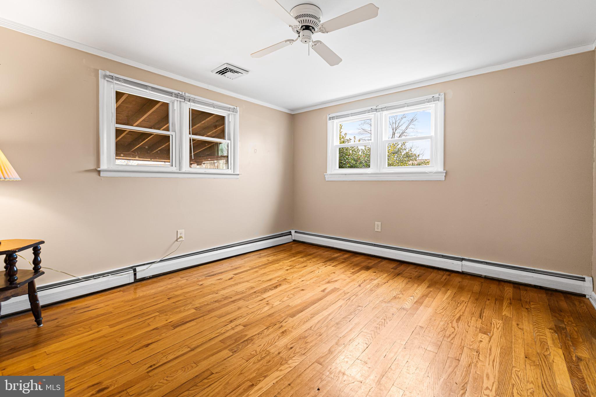 1413 Foster Road Warminster, PA 18974 - Photo 14 of 30 a view of an empty room with wooden floor and a window