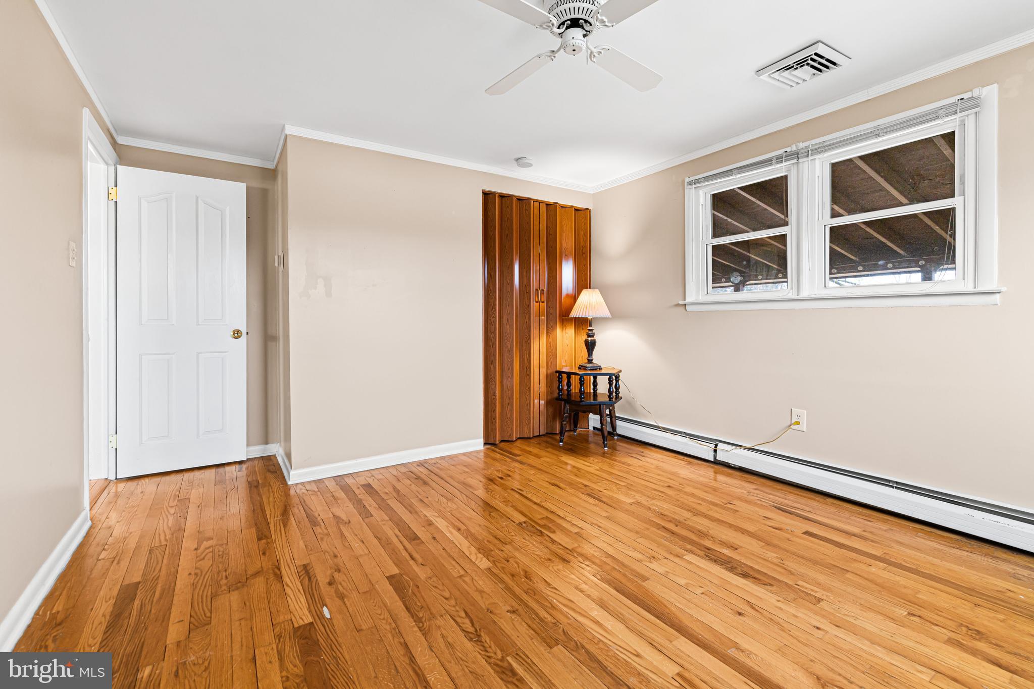 1413 Foster Road Warminster, PA 18974 - Photo 15 of 30 a view of an empty room with wooden floor and a window