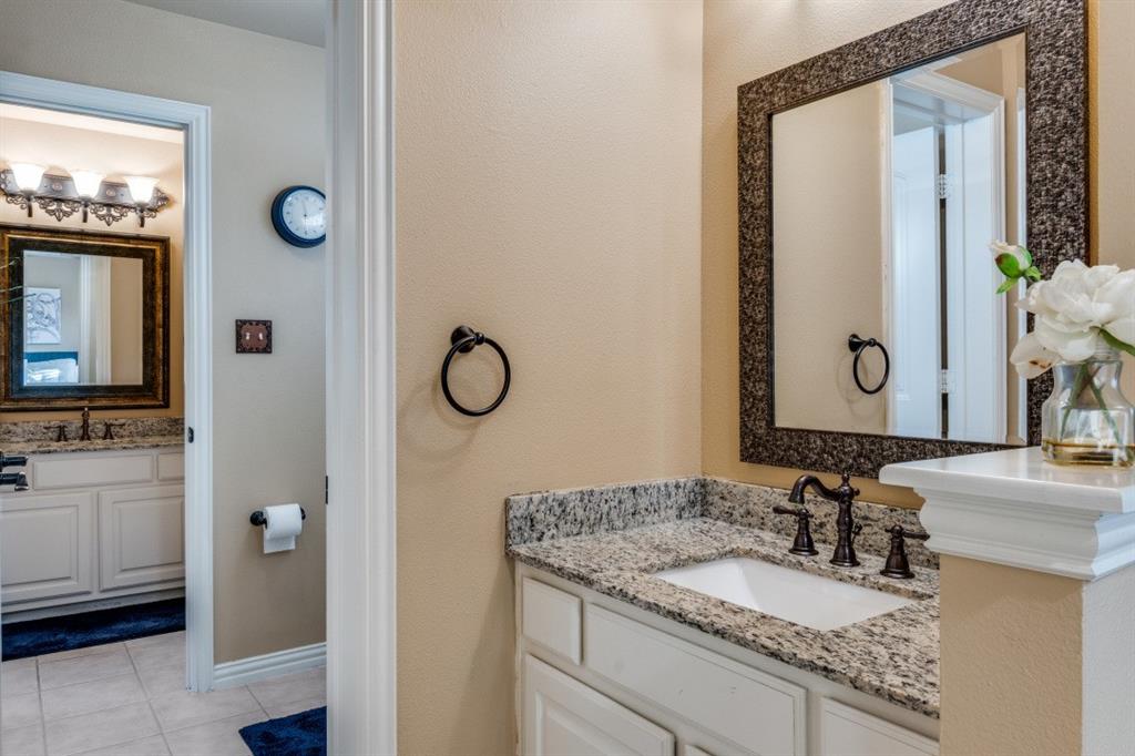 2810 Baker Street Sachse, TX 75048 - Photo 22 of 26 Full bath featuring two vanities and light tile patterned flooring