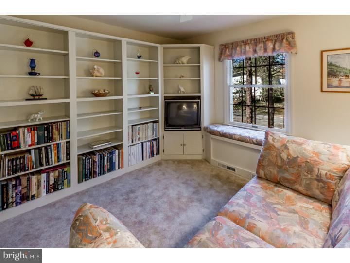 2 Carol Joy Road Medford, NJ 08055 - Photo 22 of 25 a living room with furniture and a book shelf
