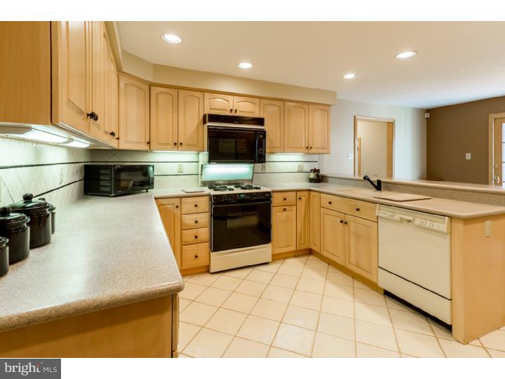 2 Carol Joy Road Medford, NJ 08055 - Photo 8 of 25 a kitchen with stainless steel appliances granite countertop a sink and a stove