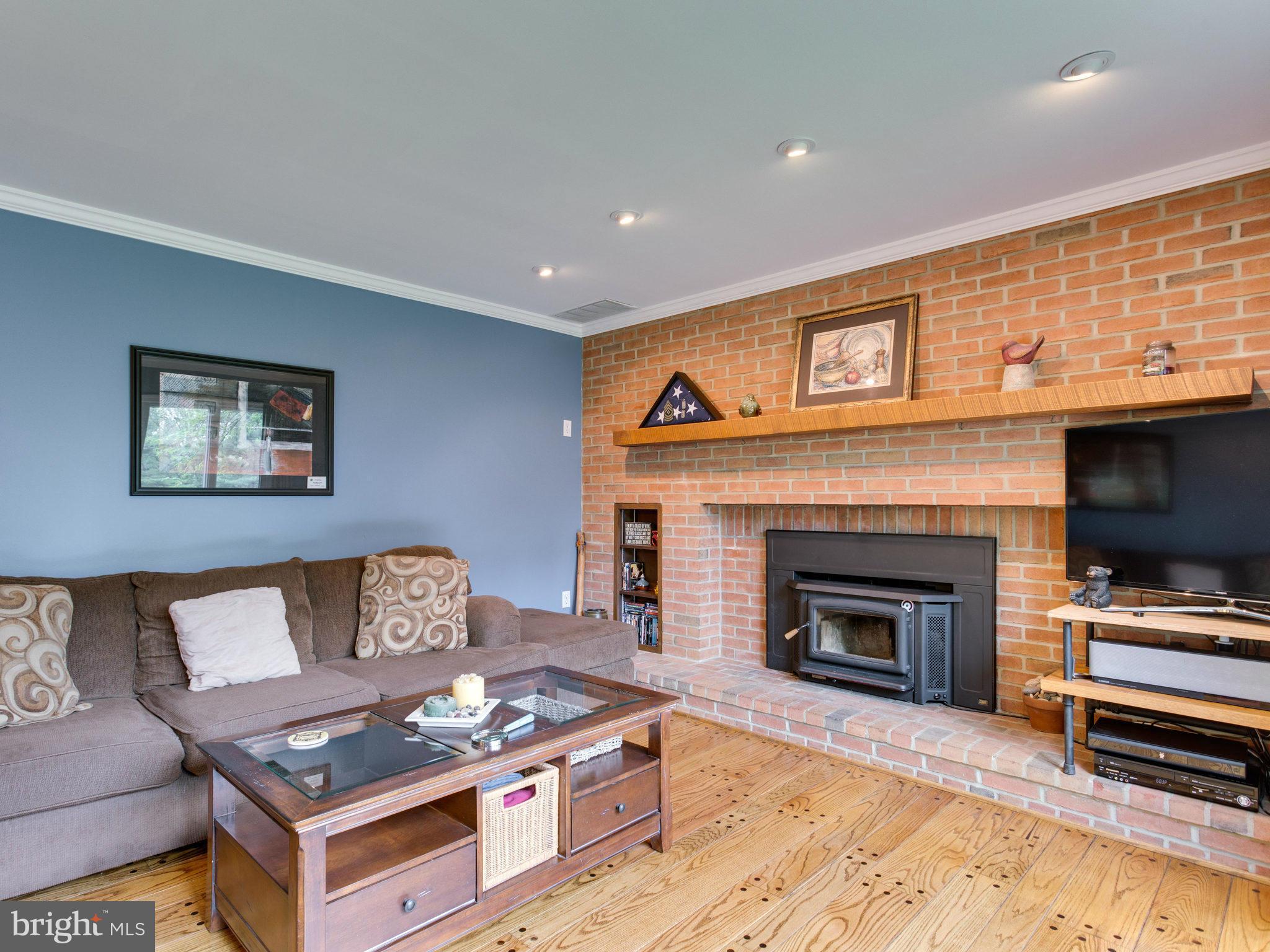 Family Room with Brick Fireplace and stove insert