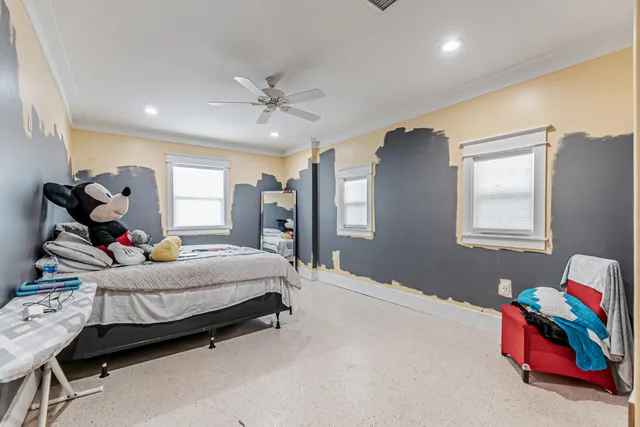 a bedroom with a bed and furniture